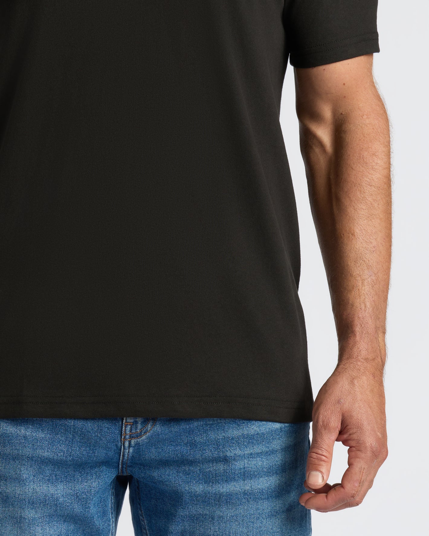 Person wearing All Black Classic V-Neck T-Shirt from 10-Pack.