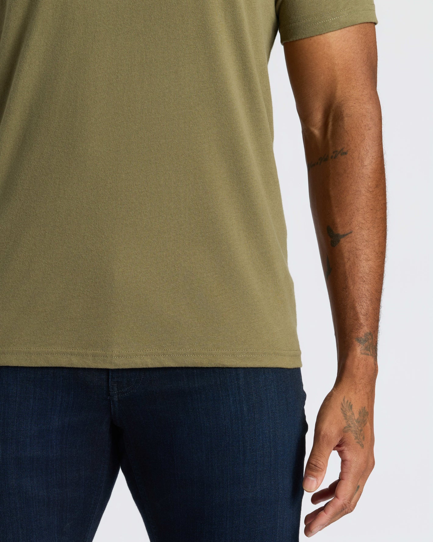 True Classic Men’s V-Neck T Shirt, olive-green, short sleeve, worn with jeans.