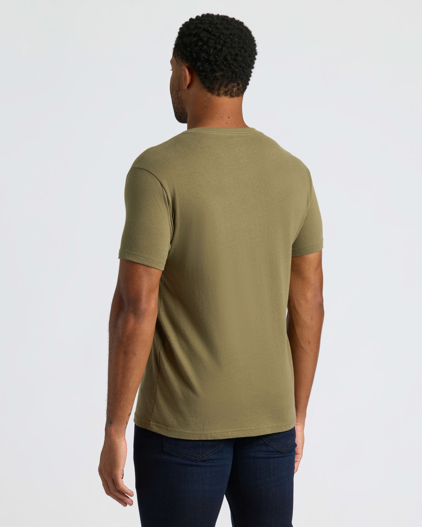 Man wearing True Classic Men’s V-Neck T Shirt, olive-green, short-sleeve, modern fit.