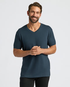 True ClassicMan in Classic V-Neck 10-Pack T-shirt, hands clasped, smiling.