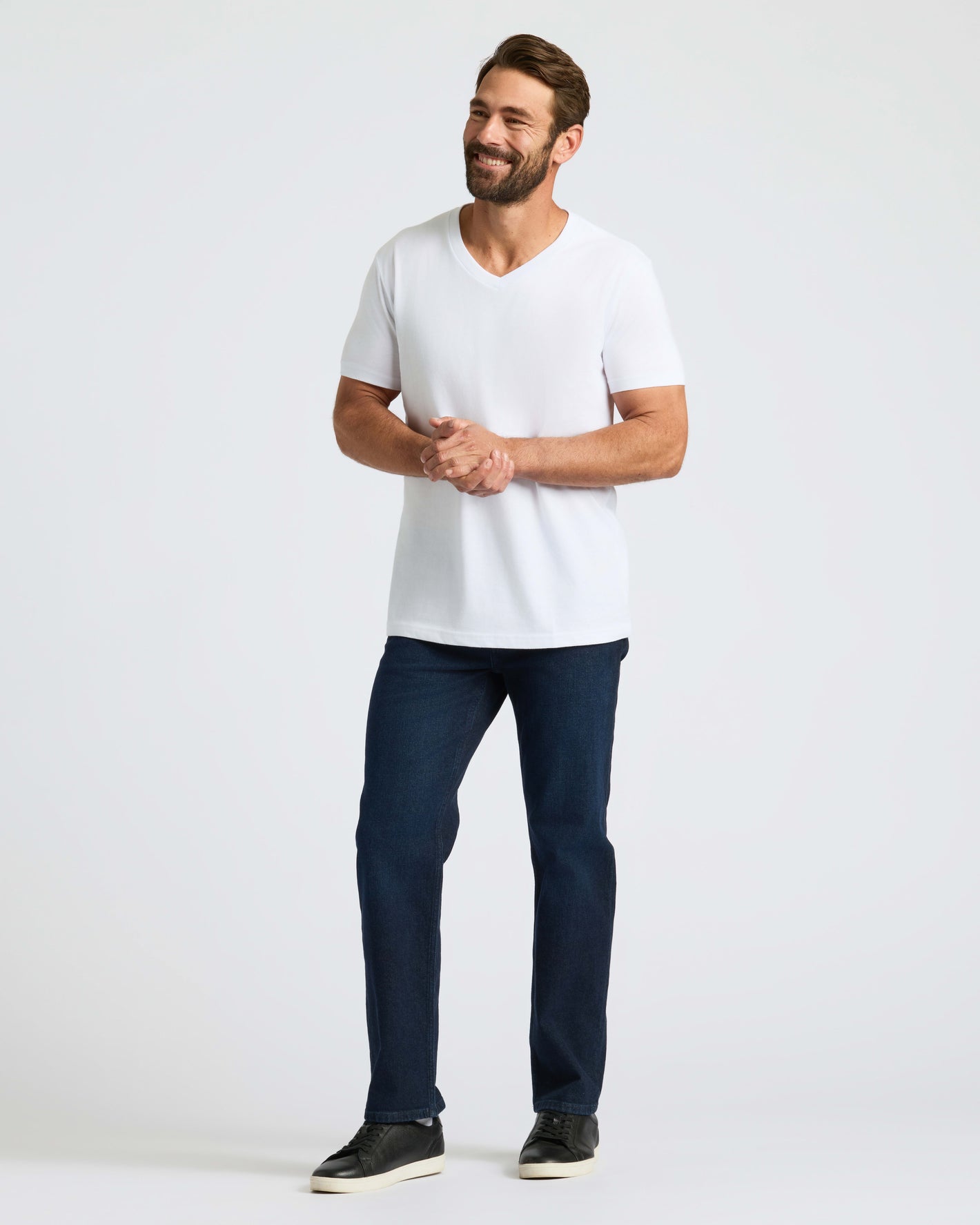 Man wears All White Classic V-Neck 10-Pack shirt.