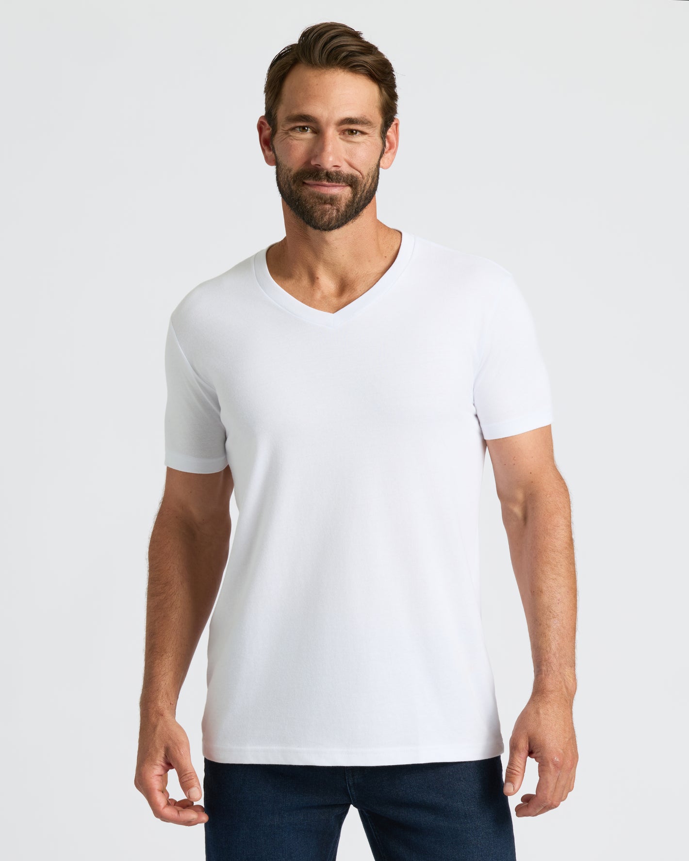Model wearing All White Classic V-Neck T-Shirt, showing its fit and style.