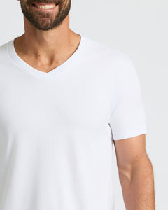 True ClassicSmiling man wearing All White Classic V-Neck 10-Pack shirt.
