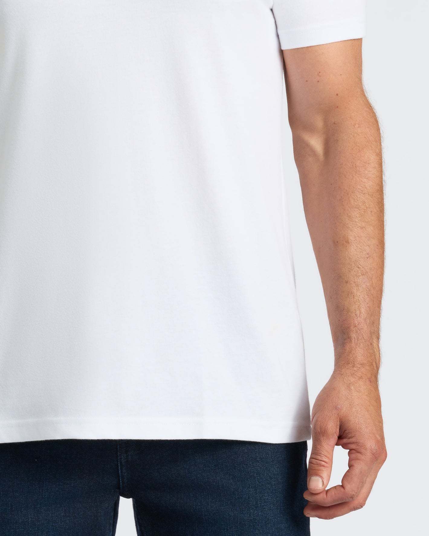 All White Classic V-Neck 10-Pack worn with dark blue jeans.