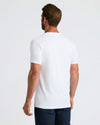 Man in All White Classic V-Neck 10-Pack and dark jeans.