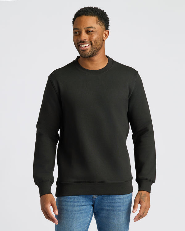 Black Fleece French Terry Pullover Crew Neck worn by smiling man.