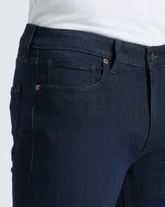 True ClassicMedium Gray Wash Slim Comfort Stretch Jeans with tucked-in white T-shirt.