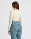 Woman in Womens Oatmeal Ribbed Long Sleeve Scoop Neck Tee, back view.