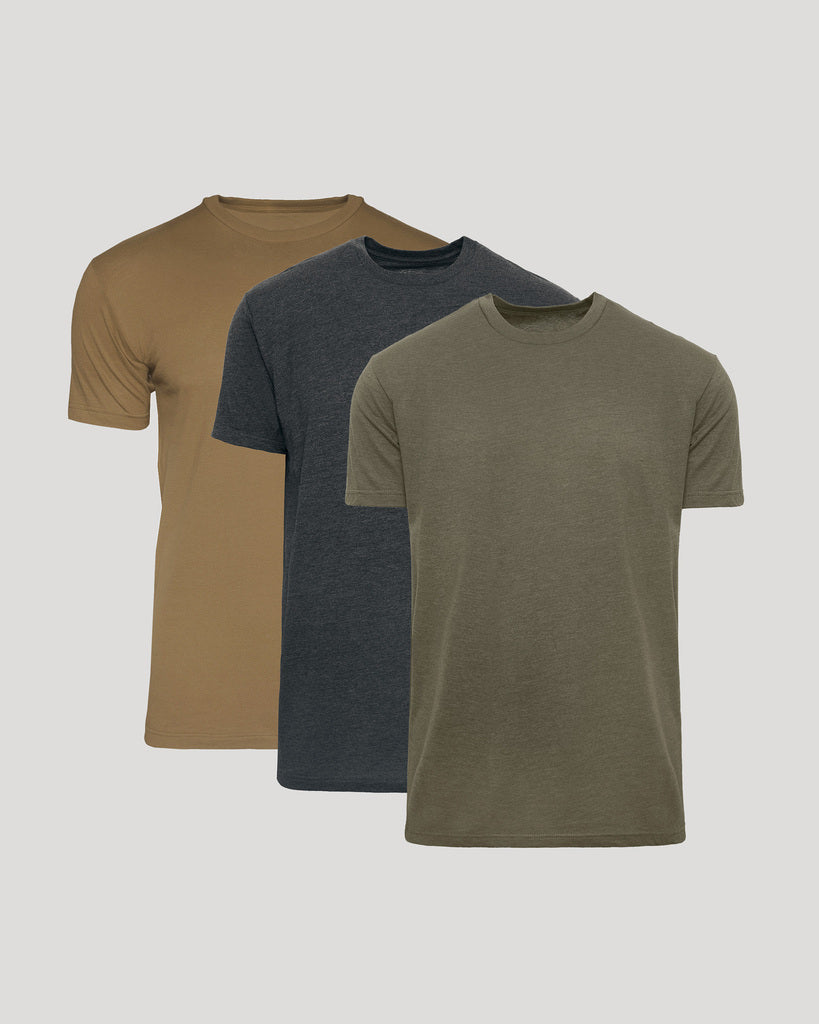 Three short-sleeve crew-neck t-shirts shown in a layered arrangement on a light gray background: tan, dark heather gray, and olive green.