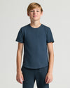 Boy wearing Boys' Classic Curved Hem Crew Neck T-shirt and pants.