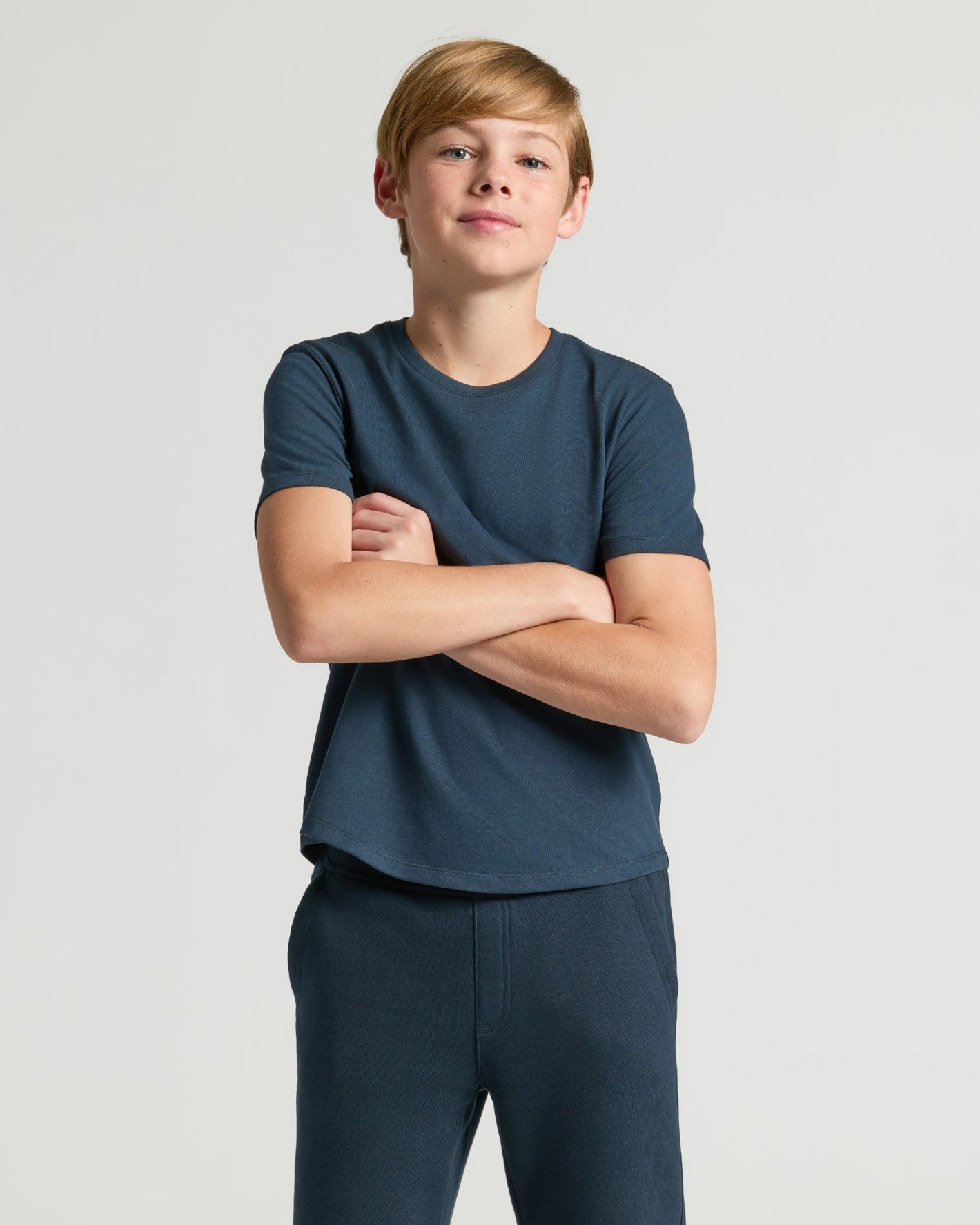 Boys' Navy Classic Curved Hem Crew Neck, worn by a young boy.