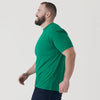 Man wearing Kelly Green Short Sleeve Crew Neck Tee mid-stride.