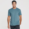 Man wearing Bluestone Short Sleeve Crew Neck Tee, dark pants, neutral expression.