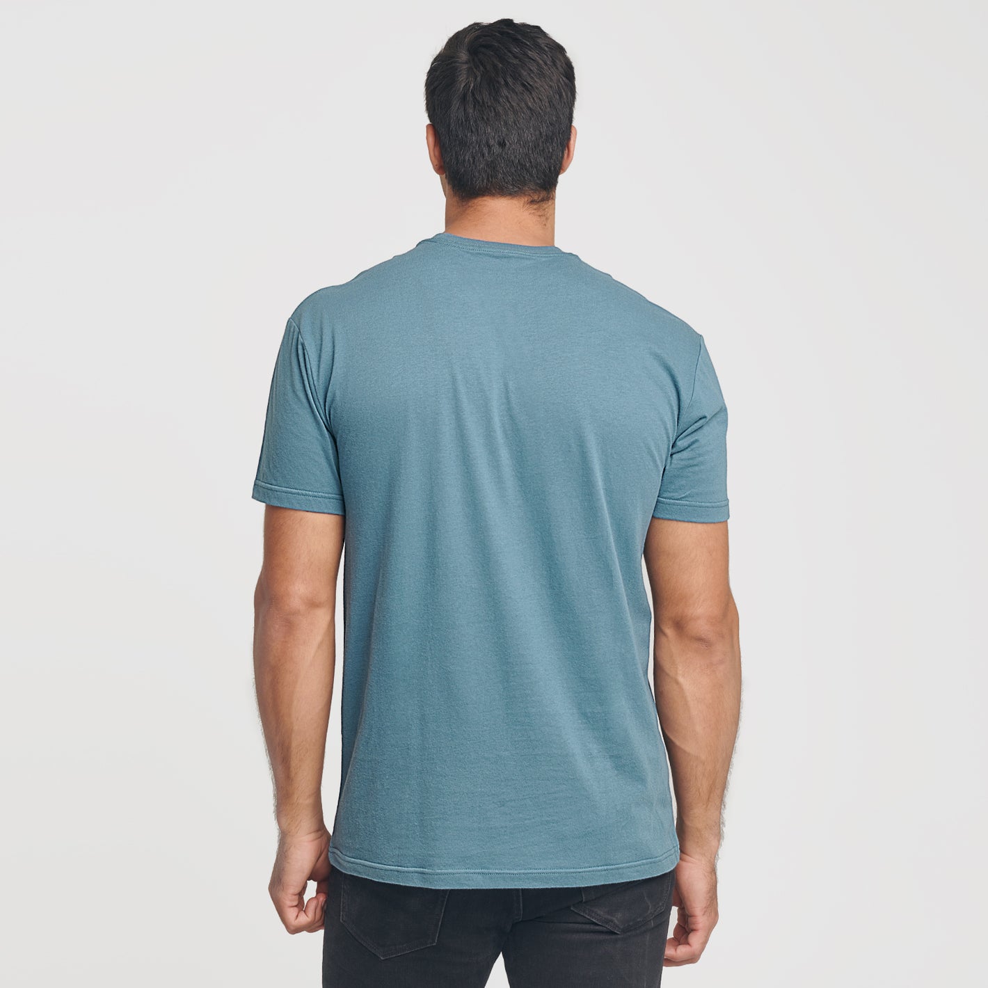 Bluestone Short Sleeve Crew Neck Tee worn by man, back view.