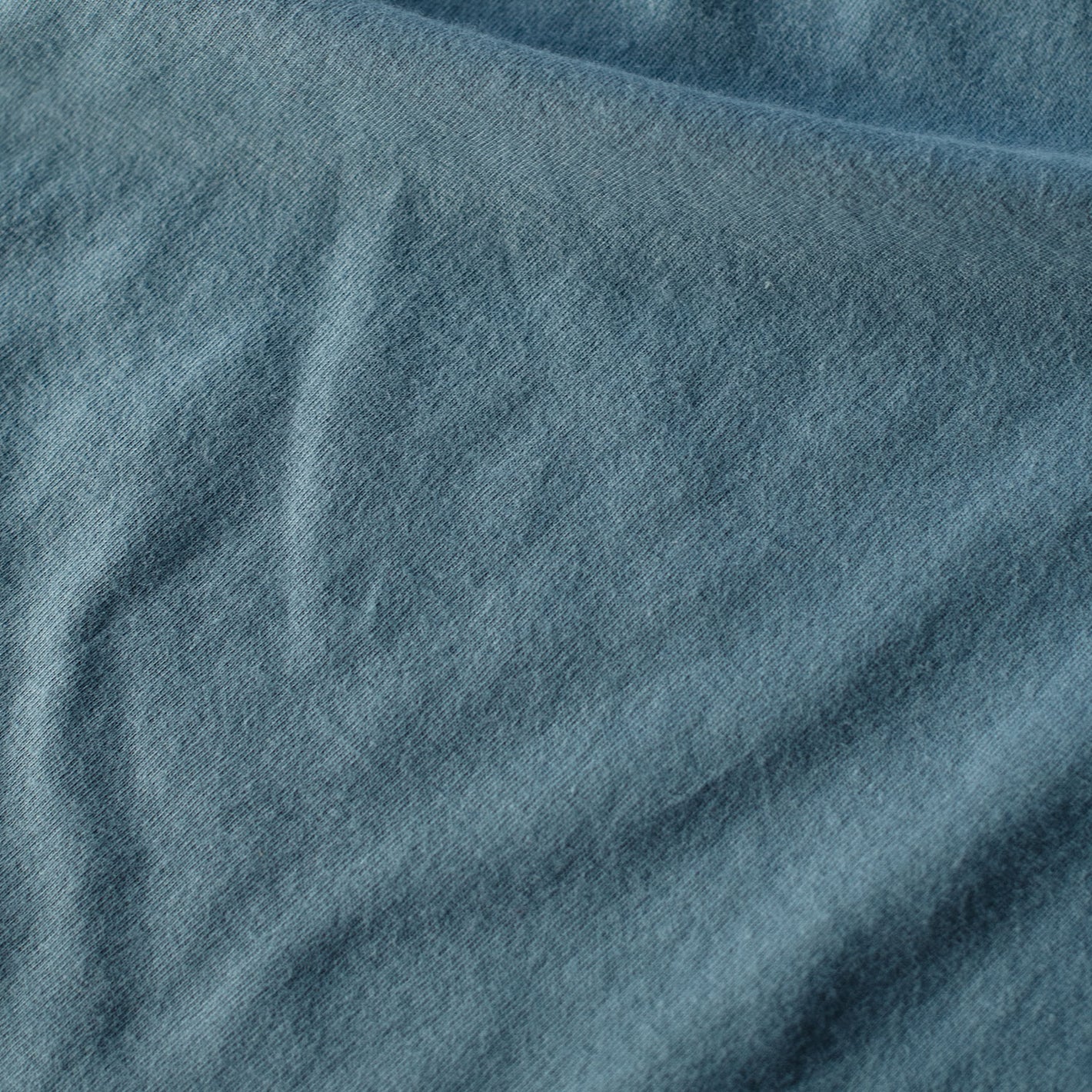 Bluestone Short Sleeve Crew Neck Tee fabric close-up showing denim-like texture.