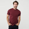 Man wearing Burgundy Short Sleeve Crew Neck Tee with dark jeans.