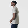 Man in Iron Gray Short Sleeve Crew Neck Tee, side view.