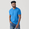 Man wearing Periwinkle Blue Short Sleeve Crew Neck Tee and jeans.