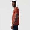 Rust Short Sleeve Crew Neck Tee on man, side profile view.