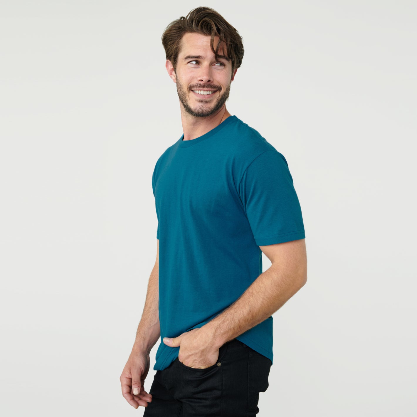 Teal Short Sleeve Crew Neck Tee worn by smiling man.