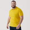 Yellow Classic Polo worn by a smiling man against a plain background.