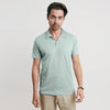 Man modeling Sage Short Sleeve Polo with khaki pants.
