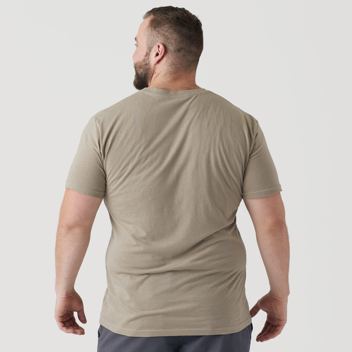 Man wearing Military Beige Classic V-Neck, back view.