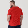 Man wearing True Red V-Neck Tee with dark denim jeans.