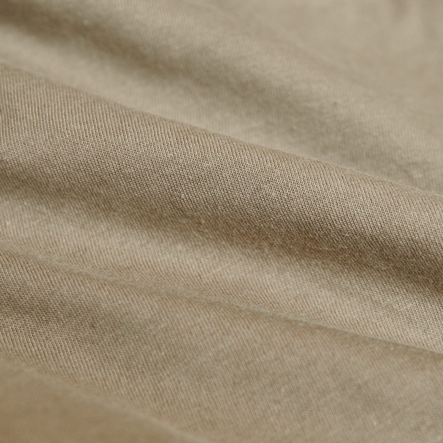 Military Beige Classic V-Neck textured, woven fabric close-up with gentle folds.