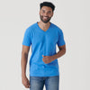 Man wearing Periwinkle Blue V-Neck Tee and blue jeans, smiling.