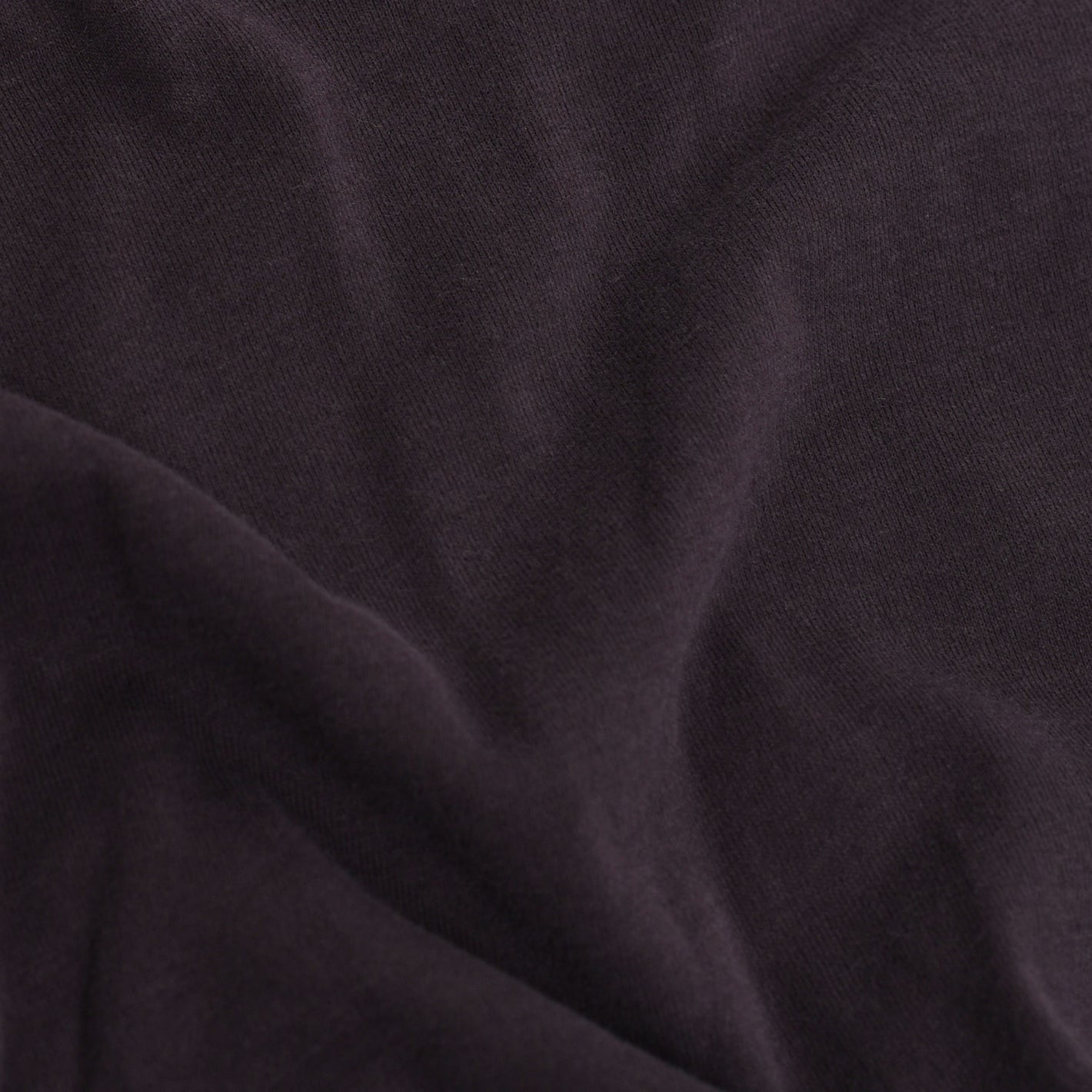 Dark Purple V-Neck Tee fabric texture and folds close-up.