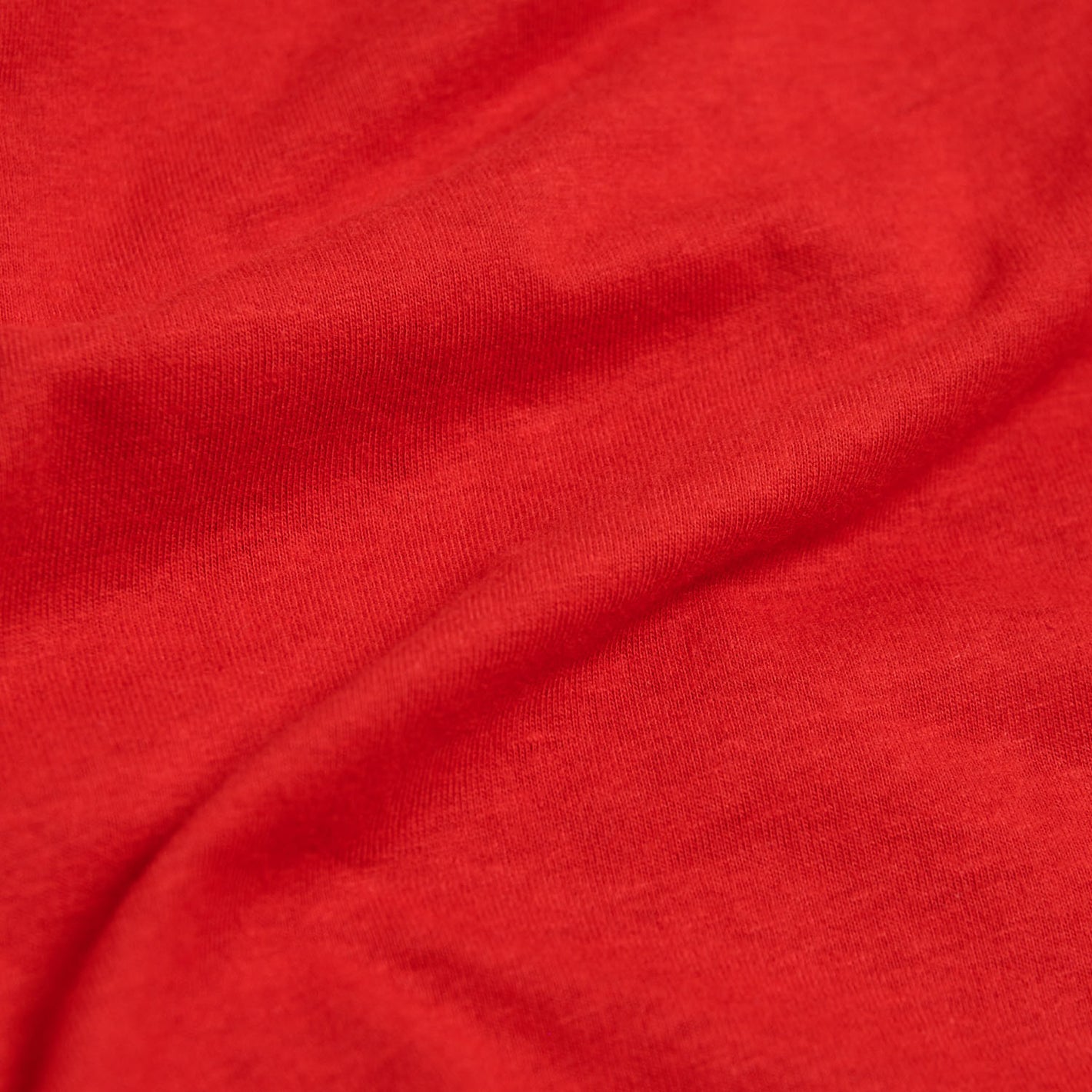 True Red V-Neck Tee, close-up of soft knit fabric.