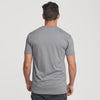 Man wearing Slate V-Neck Tee, back view, showcasing fit and design.