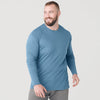 Man wearing Bluestone Long Sleeve Crew Neck Tee, looking sideways, smiling.