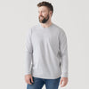Man in Light Gray Long Sleeve Crew Neck Tee and blue jeans.