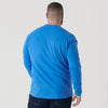 Man wearing Periwinkle Blue Long Sleeve Crew Neck Tee, dark jeans, rear view.