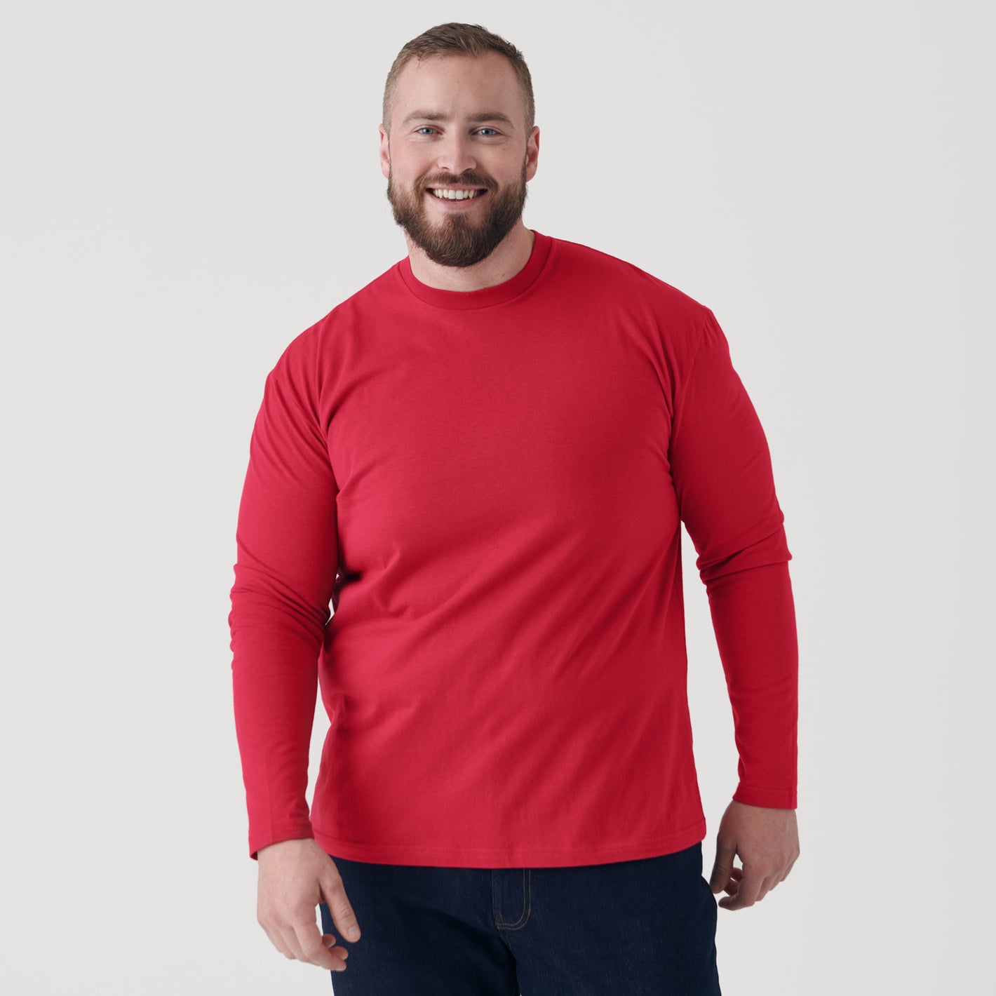 Raspberry Classic Long Sleeve Crew Neck worn by smiling man.
