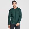 Man wearing Forest Green Long Sleeve Crew Neck Tee with dark pants.