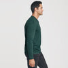 Man wearing Forest Green Long Sleeve Crew Neck Tee and black pants.