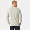 Man wearing Slate Green Long Sleeve Crew Neck Tee and dark blue jeans.
