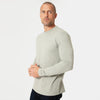 Man wearing Slate Green Long Sleeve Crew Neck Tee, dark pants.