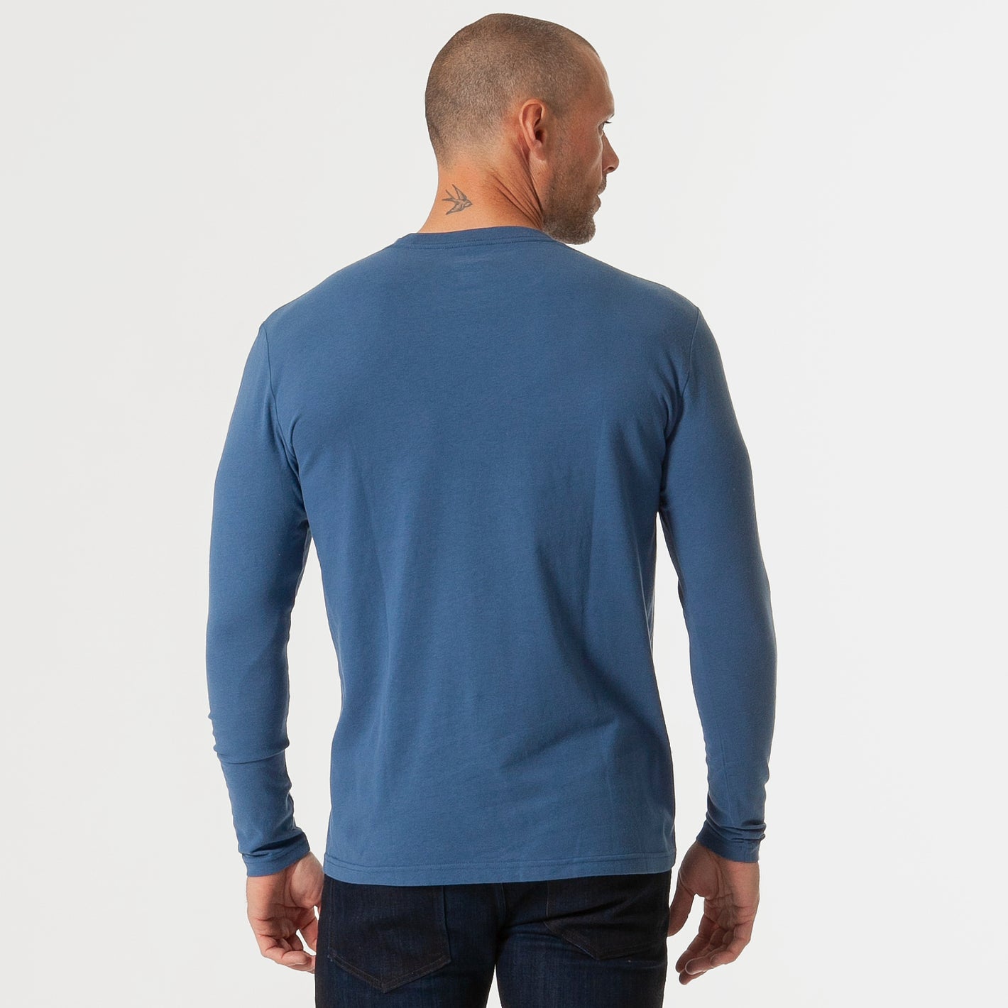 Person wearing Stone Blue Classic Long Sleeve Crew Neck, showing back view.