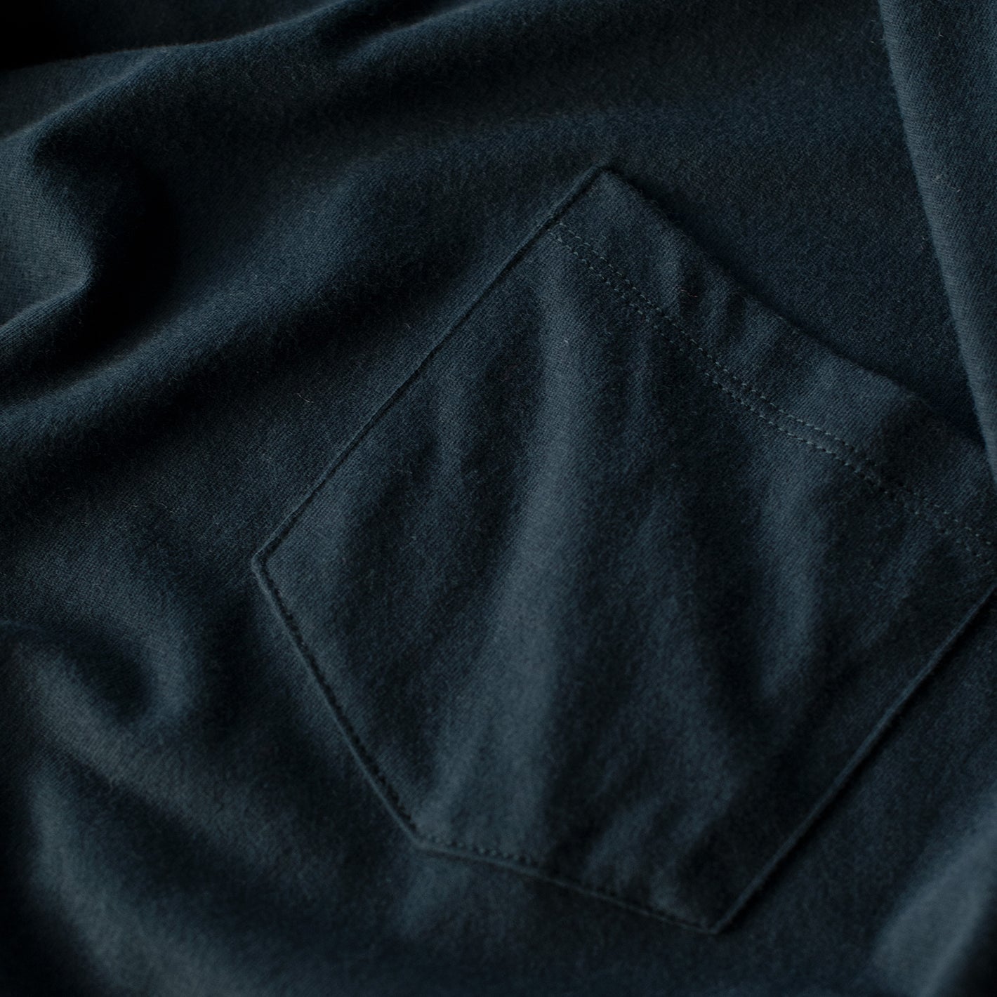 Navy Pocket Crew Tee with stitched chest pocket detail.