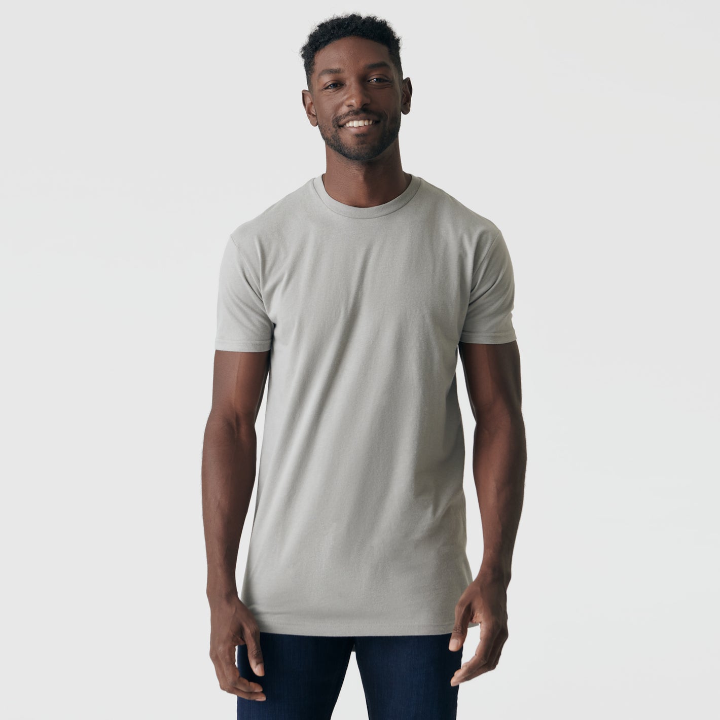 Man in Iron Gray Tall Round Hem Crew Neck T-Shirt smiling.