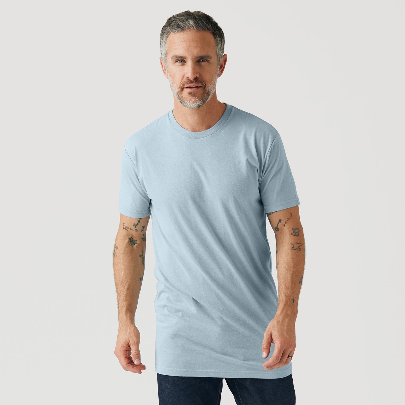 Man in Pale Blue Tall Round Hem Crew Neck T-Shirt.