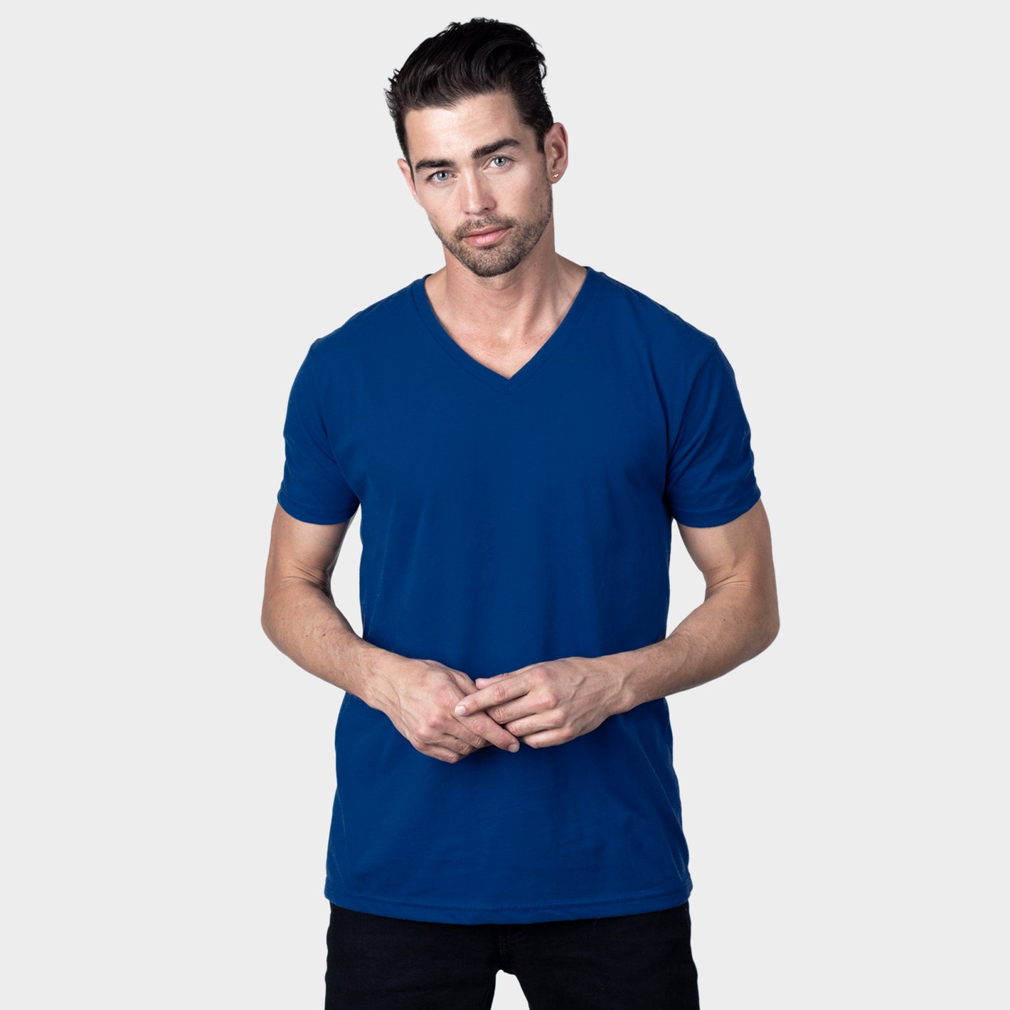 Man wearing Cobalt V-Neck Tee, showing its fitted style.
