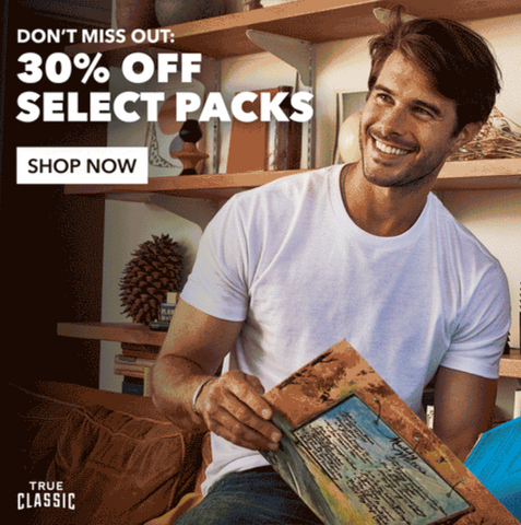 True Classic Tees advertisement of a man smiling, looking off in the distance, and text saying: Don't miss out: 30% off select packs, shop now.