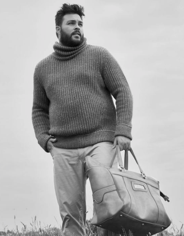 black and white photo of  a bearded man wearing a turtle neck sweater
